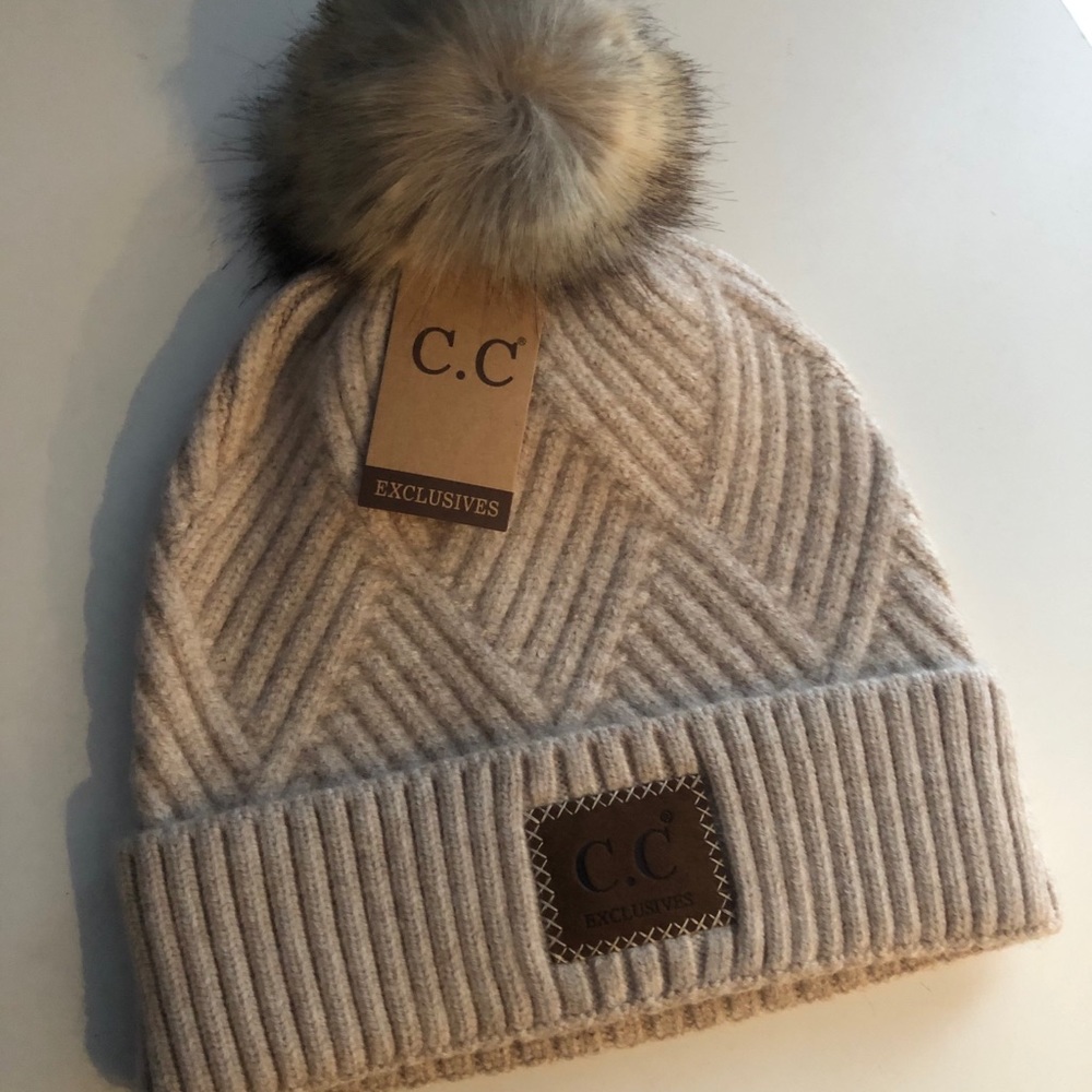 Beanie hat with puff ball